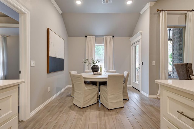 dining area with light wood finished floors, recessed lighting, baseboards, and vaulted ceiling