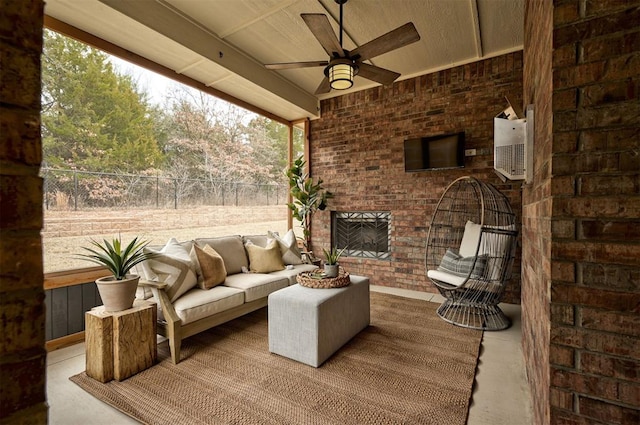 view of patio featuring an outdoor living space with a fireplace, ceiling fan, and fence