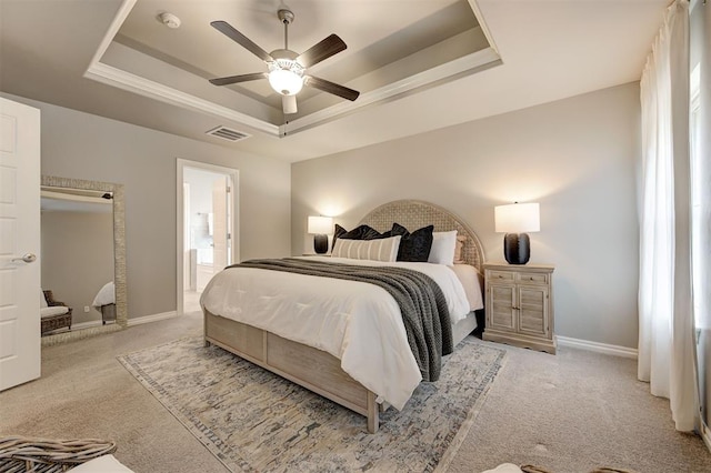 bedroom featuring visible vents, carpet flooring, baseboards, and a tray ceiling