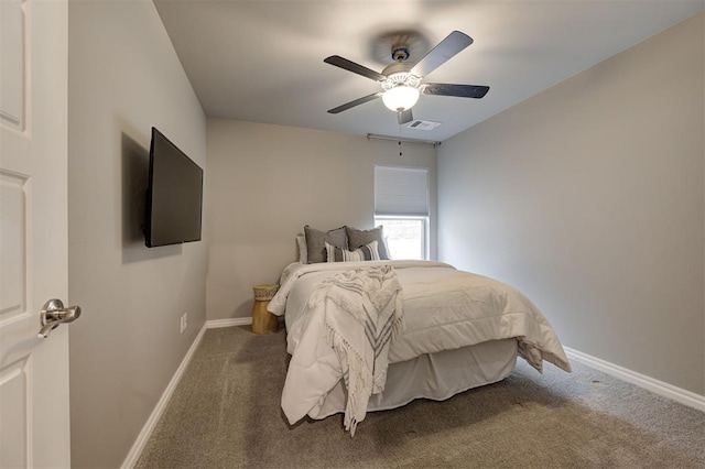 bedroom with carpet flooring, visible vents, a ceiling fan, and baseboards