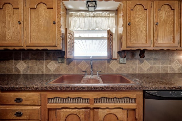 kitchen featuring dishwasher, brown cabinets, tasteful backsplash, and a sink