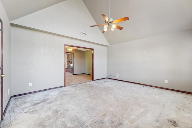 spare room featuring baseboards, visible vents, high vaulted ceiling, and ceiling fan