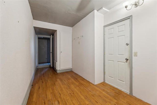 hallway with wood finished floors