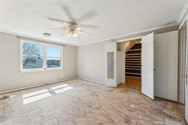 unfurnished bedroom with visible vents, baseboards, ornamental molding, and a ceiling fan