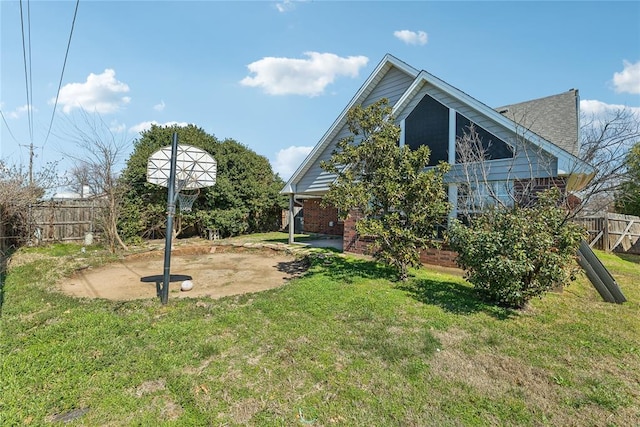 back of house with a yard, a patio, and fence