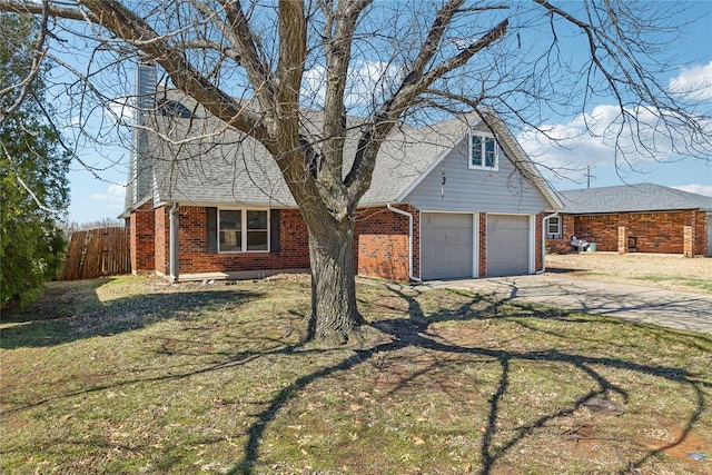 view of front of house featuring a front yard, brick siding, driveway, and fence