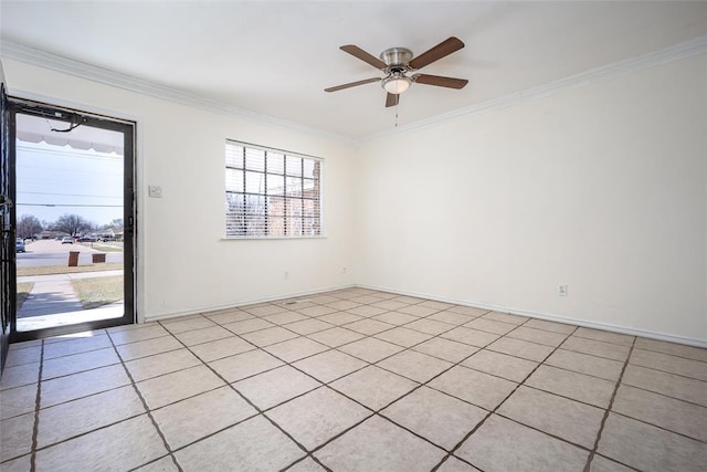 spare room with crown molding, baseboards, and ceiling fan