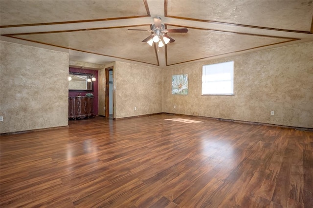 unfurnished room featuring ceiling fan, lofted ceiling, and wood finished floors