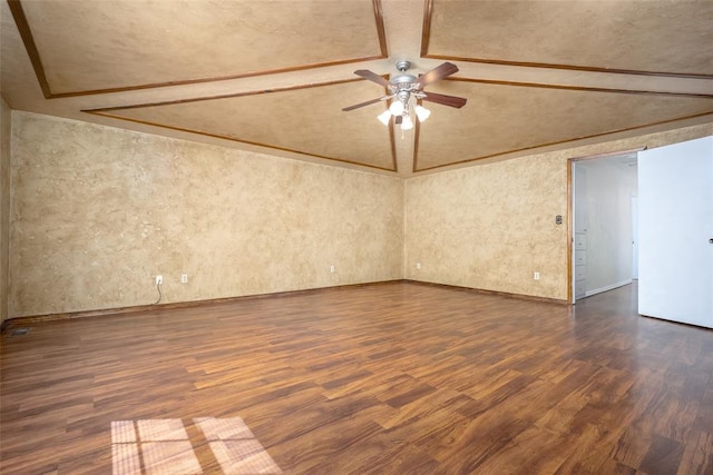 empty room with dark wood finished floors, lofted ceiling, and ceiling fan