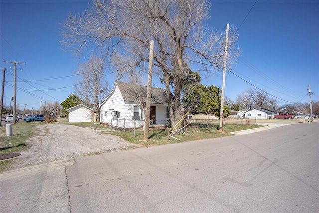 view of front of home featuring fence