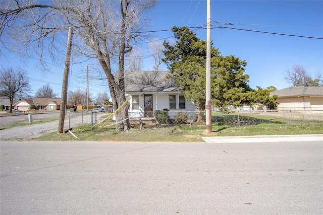 bungalow-style home featuring a fenced front yard