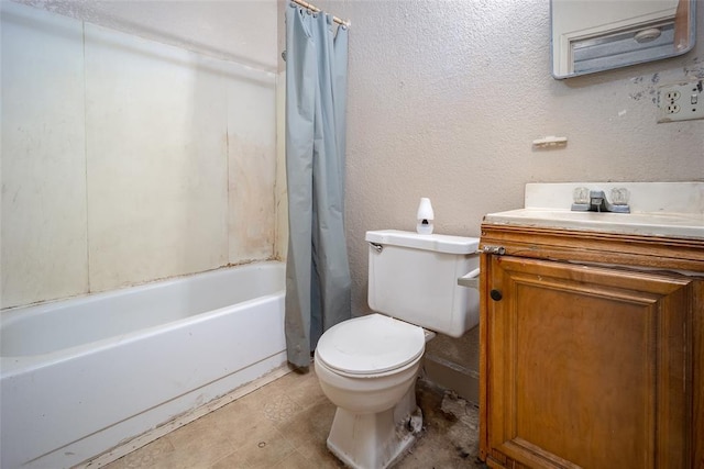 full bath featuring shower / bath combo, toilet, vanity, and a textured wall