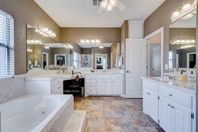 bathroom featuring a sink, visible vents, and ceiling fan