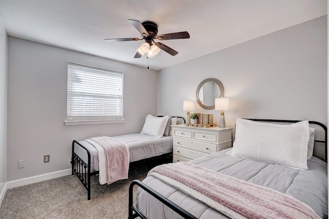 bedroom featuring carpet flooring, a ceiling fan, and baseboards