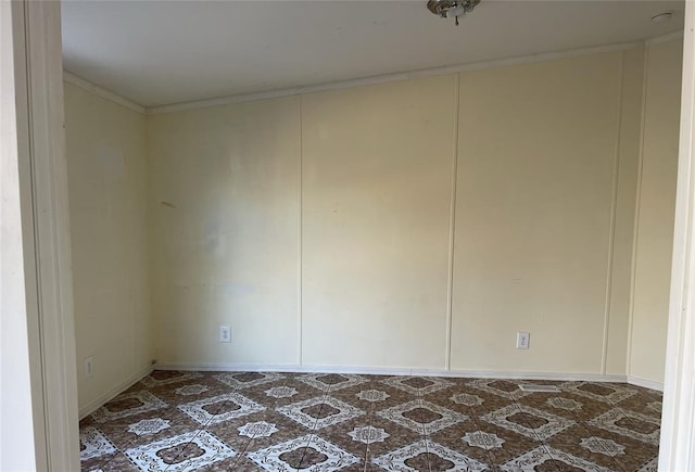 unfurnished room featuring ornamental molding