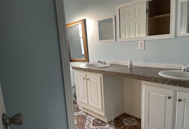 bathroom with double vanity and a sink