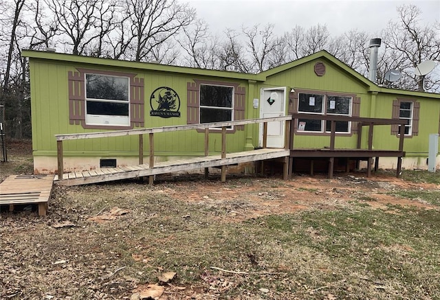 manufactured / mobile home with crawl space and a wooden deck