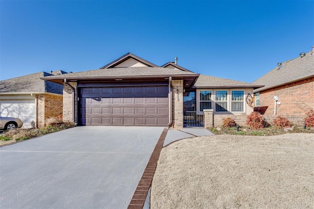 ranch-style house featuring brick siding, an attached garage, concrete driveway, and a shingled roof