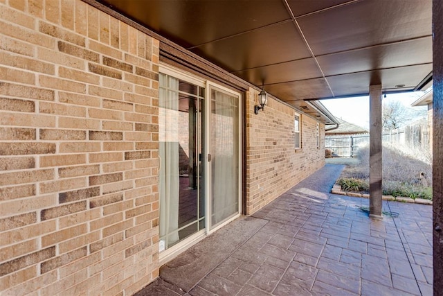 view of patio / terrace featuring fence