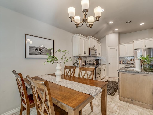 dining area with recessed lighting, visible vents, and a chandelier