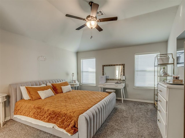 bedroom featuring visible vents, baseboards, vaulted ceiling, carpet flooring, and a ceiling fan