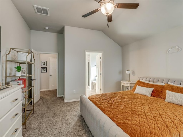 carpeted bedroom featuring a ceiling fan, baseboards, visible vents, vaulted ceiling, and connected bathroom