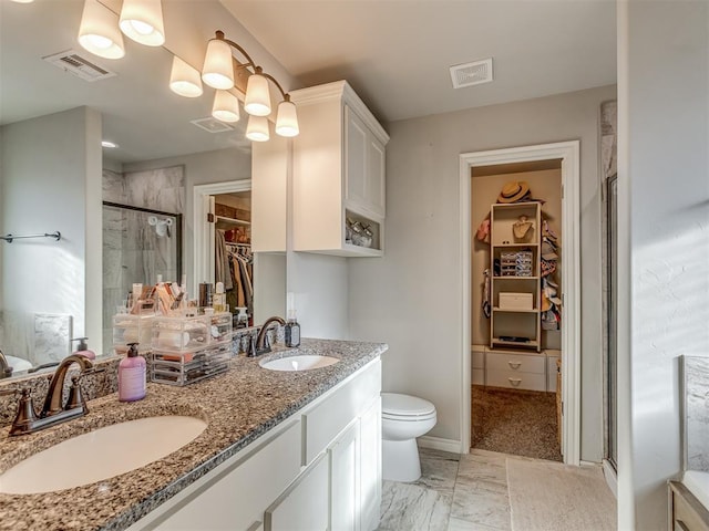 bathroom with a sink, visible vents, and a stall shower