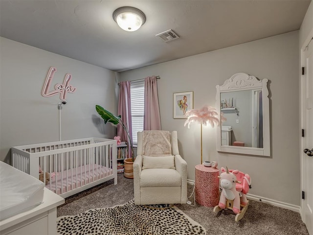 bedroom featuring carpet flooring, a nursery area, baseboards, and visible vents