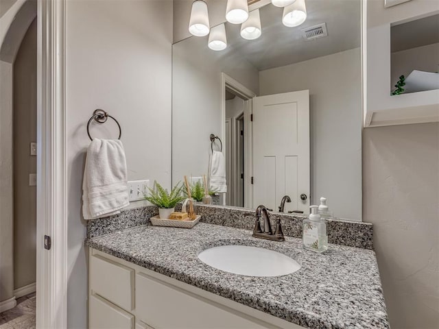 bathroom with visible vents and vanity