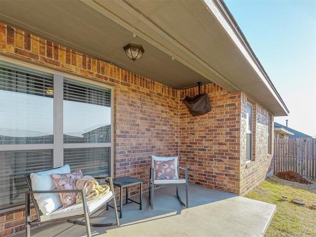 view of patio featuring fence