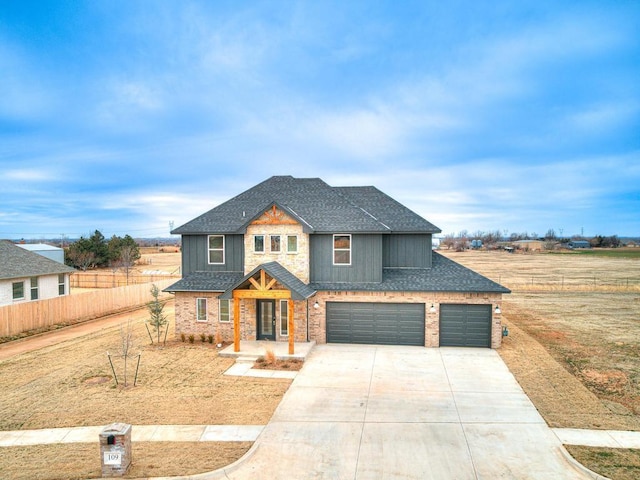 craftsman house featuring fence, concrete driveway, roof with shingles, french doors, and an attached garage