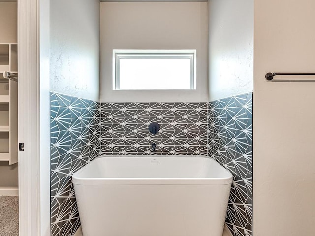 bathroom featuring a freestanding tub