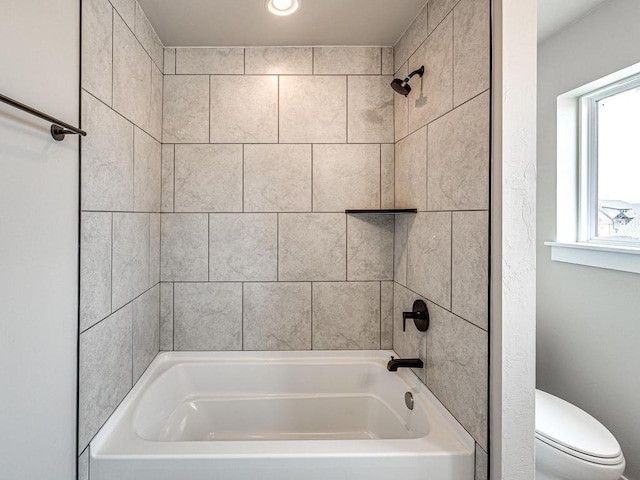 bathroom featuring  shower combination and toilet