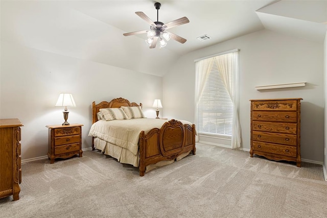 bedroom with visible vents, baseboards, carpet, and lofted ceiling