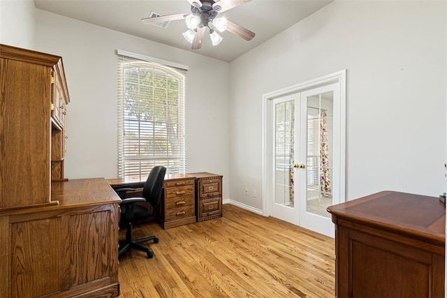 office space with light wood finished floors, french doors, and ceiling fan