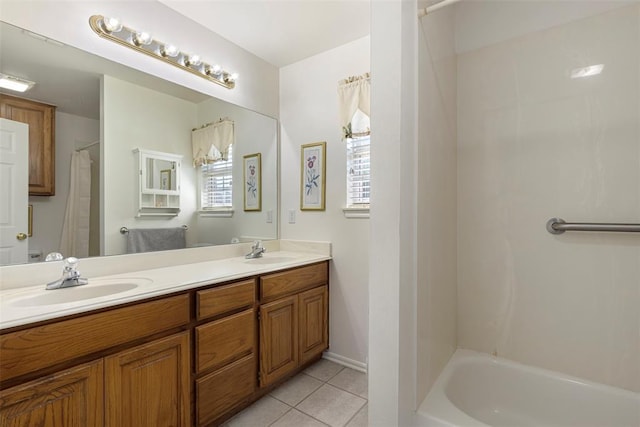 bathroom with tile patterned flooring, double vanity, and a sink