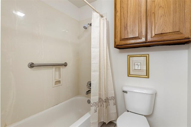 full bath featuring toilet and shower / bath combo with shower curtain