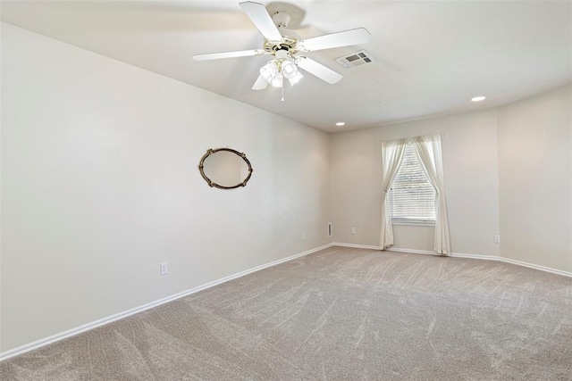 empty room featuring carpet, visible vents, baseboards, recessed lighting, and ceiling fan