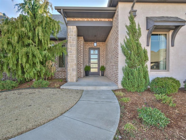 property entrance with stucco siding