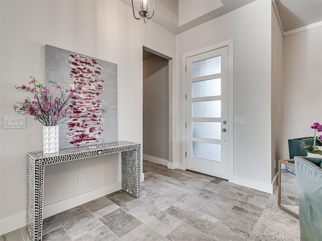 entrance foyer with baseboards and a healthy amount of sunlight