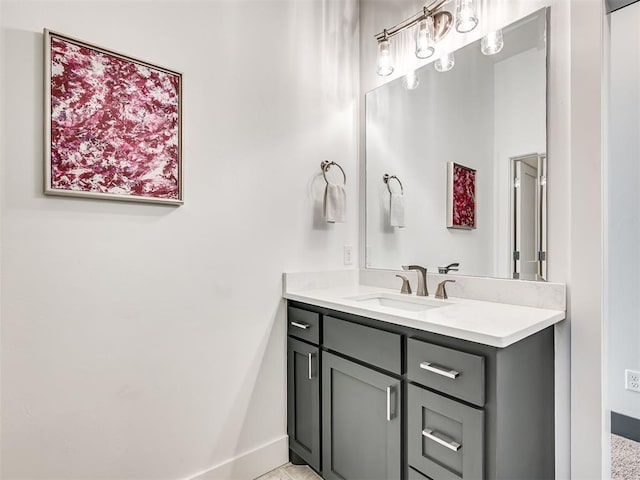 bathroom featuring vanity and baseboards