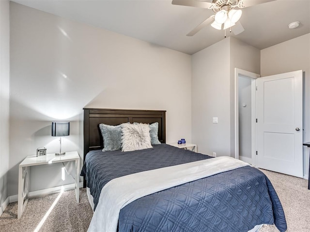 carpeted bedroom with baseboards and a ceiling fan