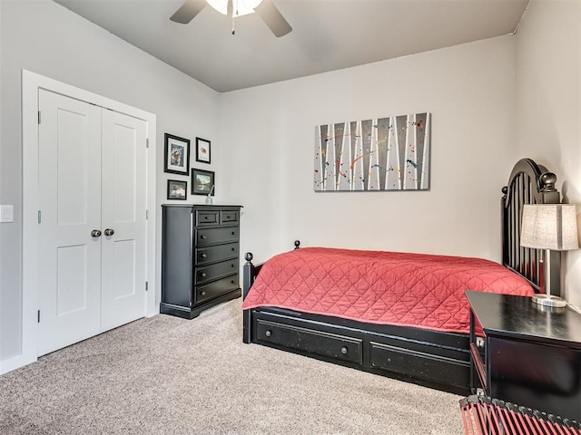 bedroom with a closet, carpet floors, and ceiling fan