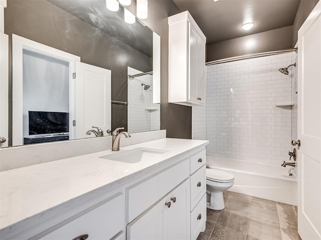 bathroom featuring vanity, toilet, and tub / shower combination