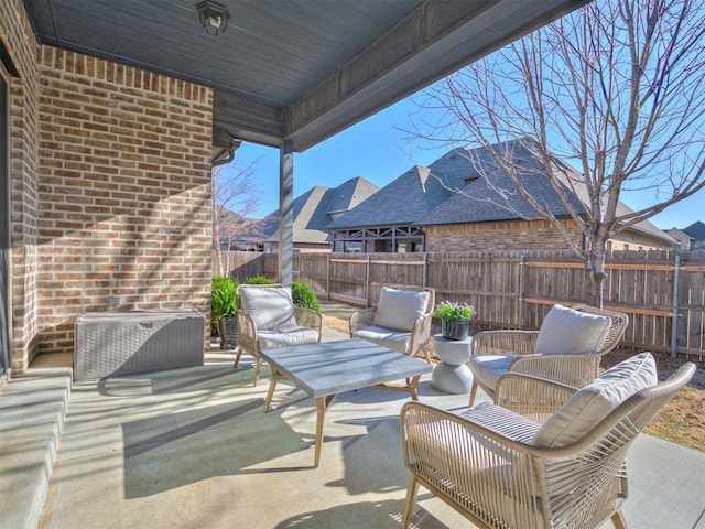 view of patio with outdoor lounge area and a fenced backyard