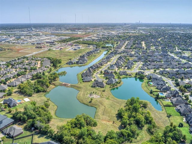 birds eye view of property featuring a residential view and a water view