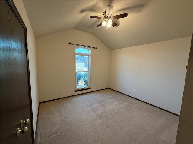 bonus room featuring vaulted ceiling, a ceiling fan, baseboards, and light carpet