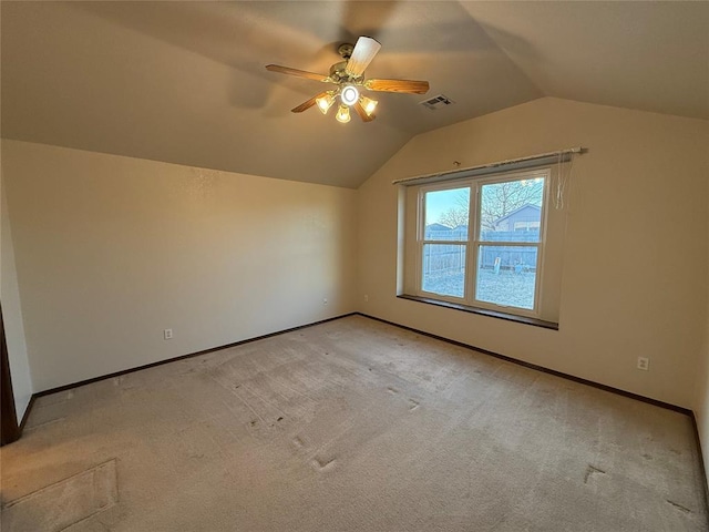 bonus room with visible vents, baseboards, vaulted ceiling, light carpet, and a ceiling fan