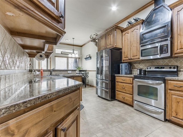 kitchen featuring backsplash, stainless steel appliances, light tile patterned flooring, crown molding, and a chandelier