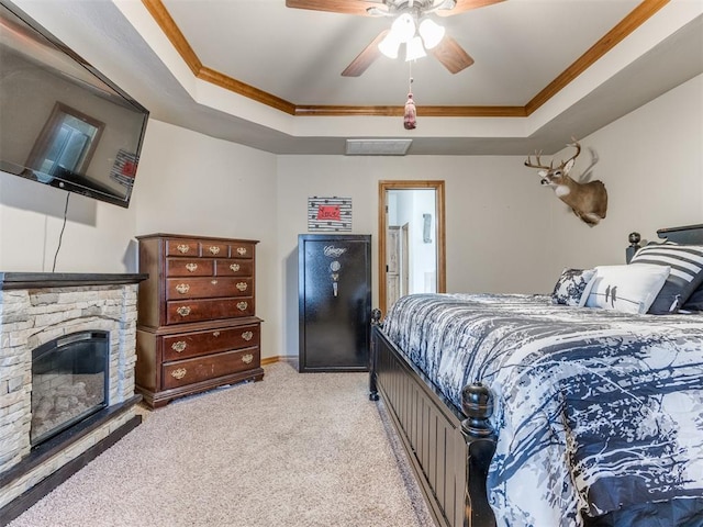 carpeted bedroom featuring a raised ceiling, crown molding, and visible vents